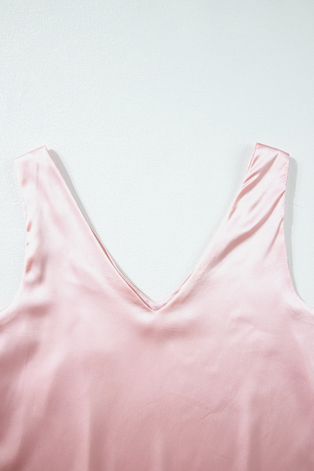 Pink deep V neck loose tank top with sleeveless design and relaxed fit