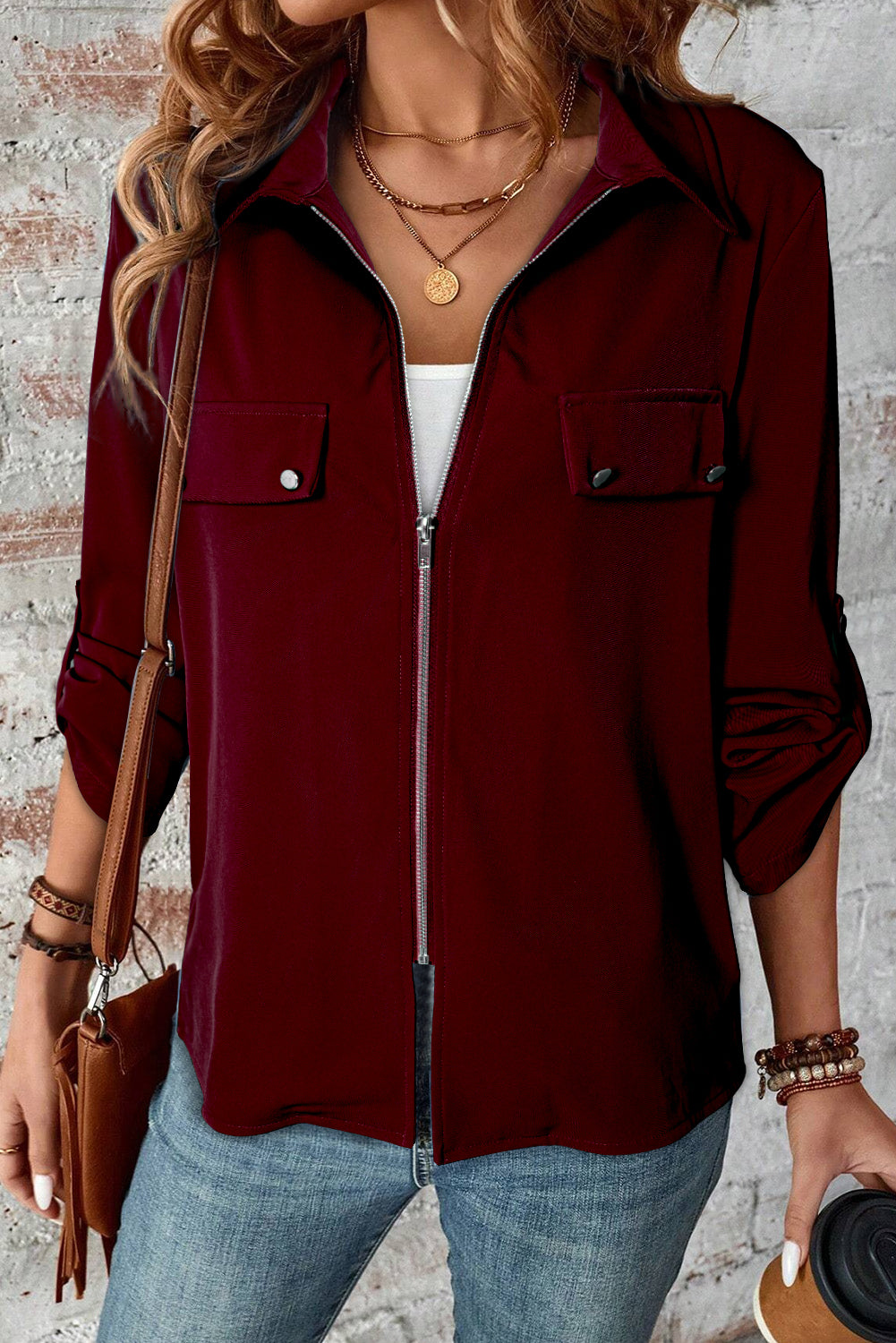 Black collar jacket with tab sleeves and zip-up closure