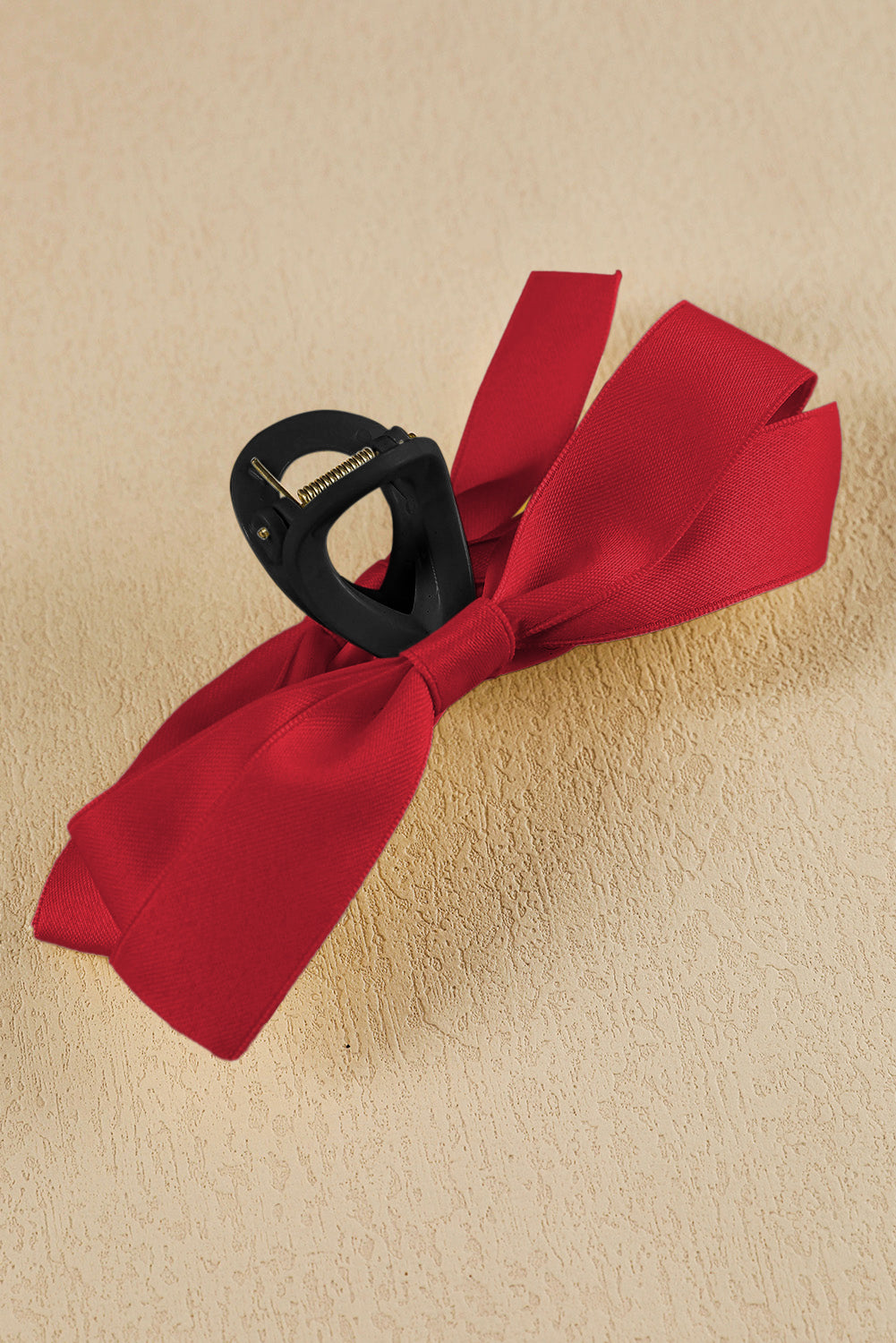 Black bow decor large hair claw clip securing hair with elegant bow knot design