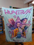 K-POP DEMON HUNTERS Huntrix Stars fleece blanket featuring Rumi, Zoey, and Mira in vibrant star-shaped design