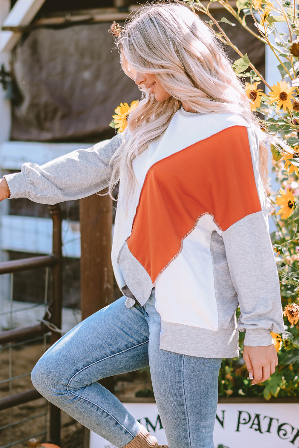 Light French beige colorblock long sleeve top with irregular hem and patchwork stitching