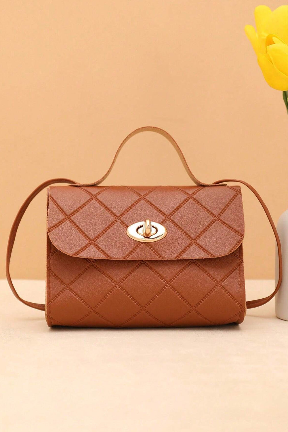 Breen PU leather messenger bag with diamond pattern and lock closure