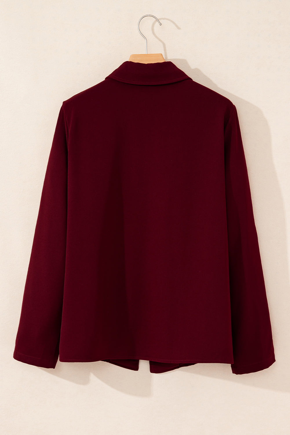 Black collar jacket with tab sleeves and zip-up closure