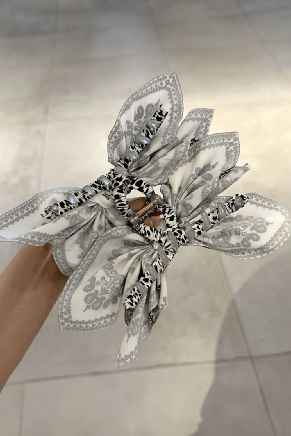Black paisley floral print bow knot hair clip with stylish design and lightweight material