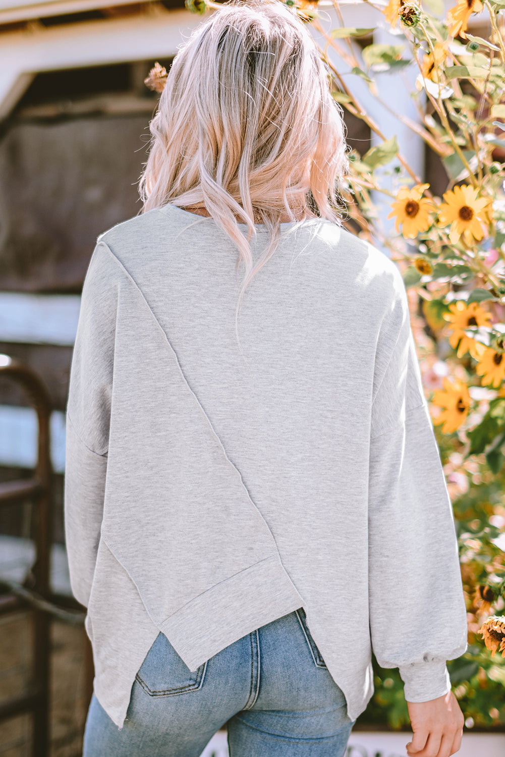 Light French Beige colorblock long sleeve top with irregular hem and stitch detailing