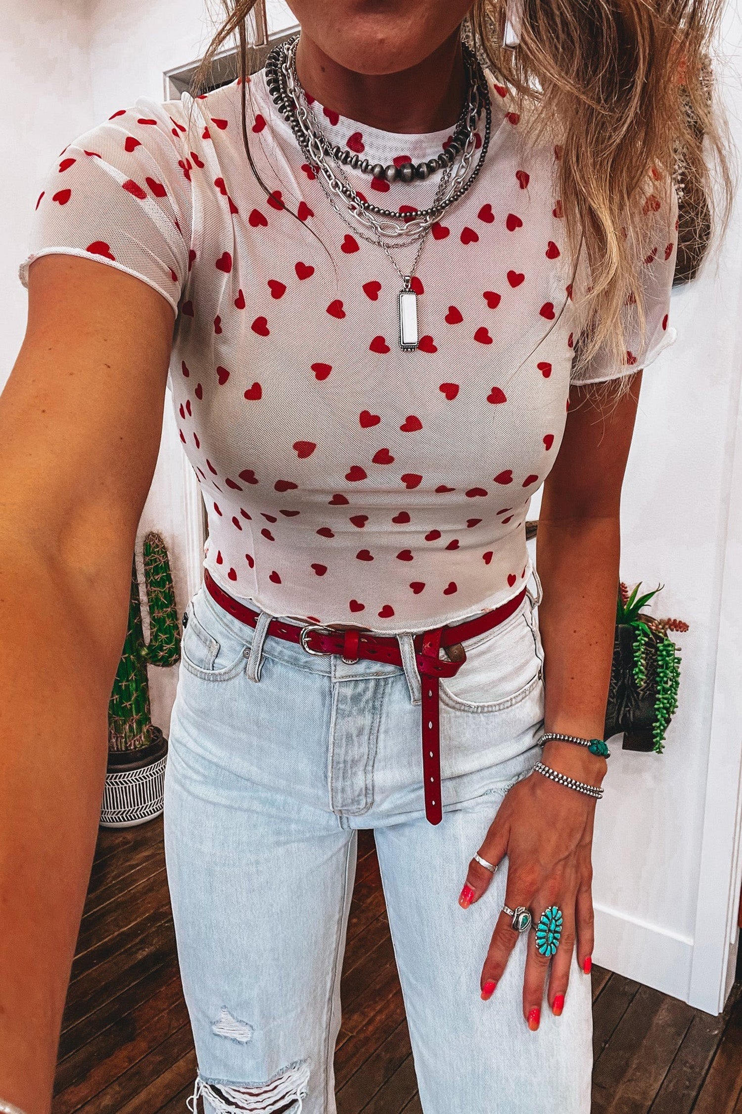 Pink mesh crop top with allover heart print and lettuce trim