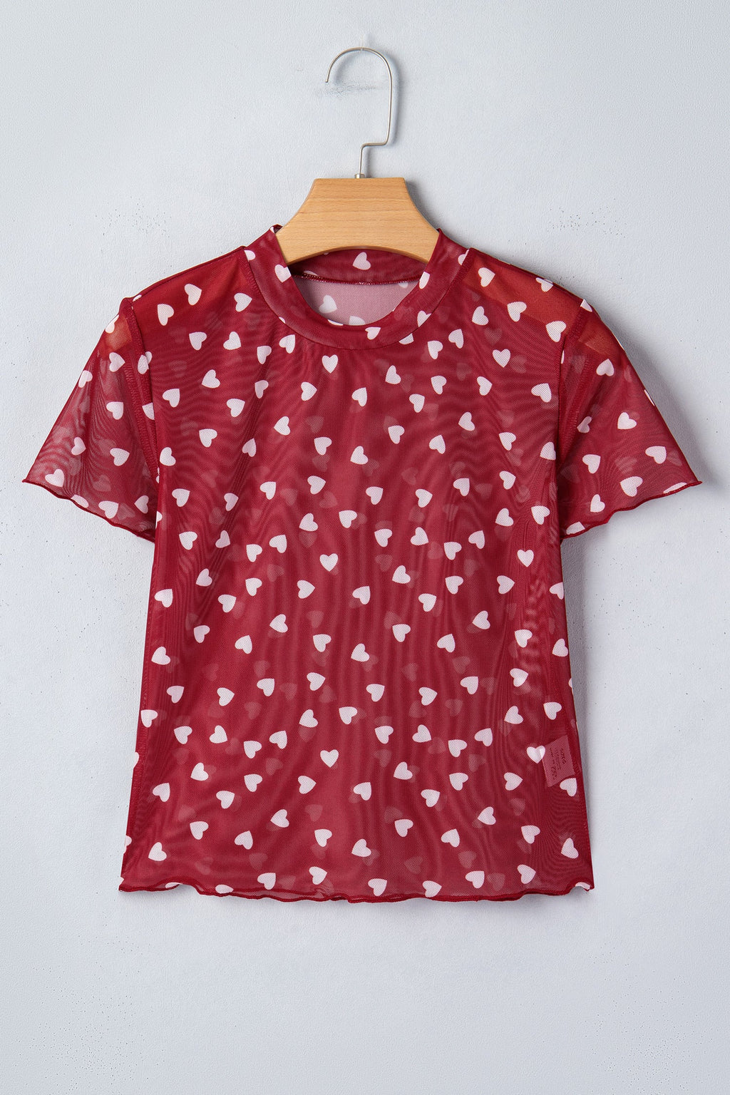 Pink mesh crop top with allover heart print and lettuce trim