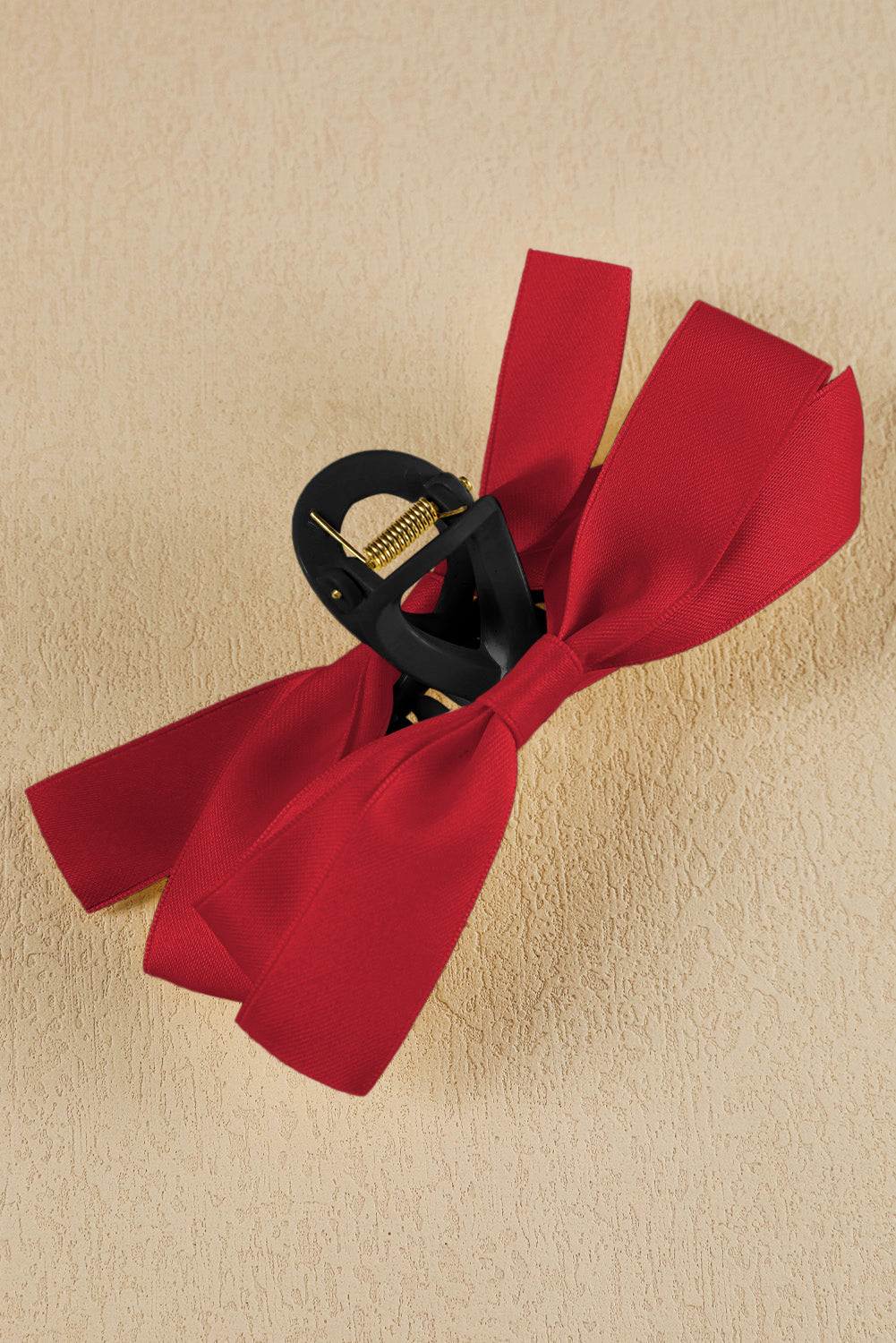 Black bow decor large hair claw clip securing hair elegantly