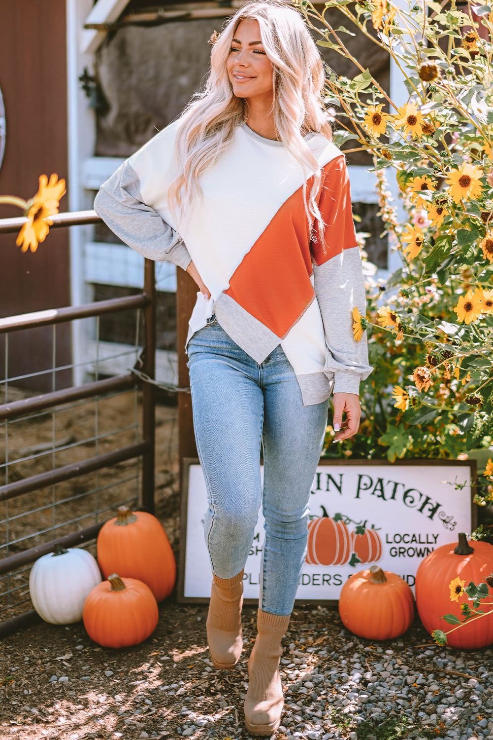 Light French Beige colorblock long sleeve top with irregular hem and stitching details