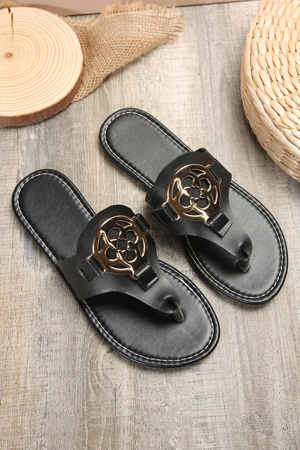 Beige leather thong slippers with stylish metal decor and adjustable strap design
