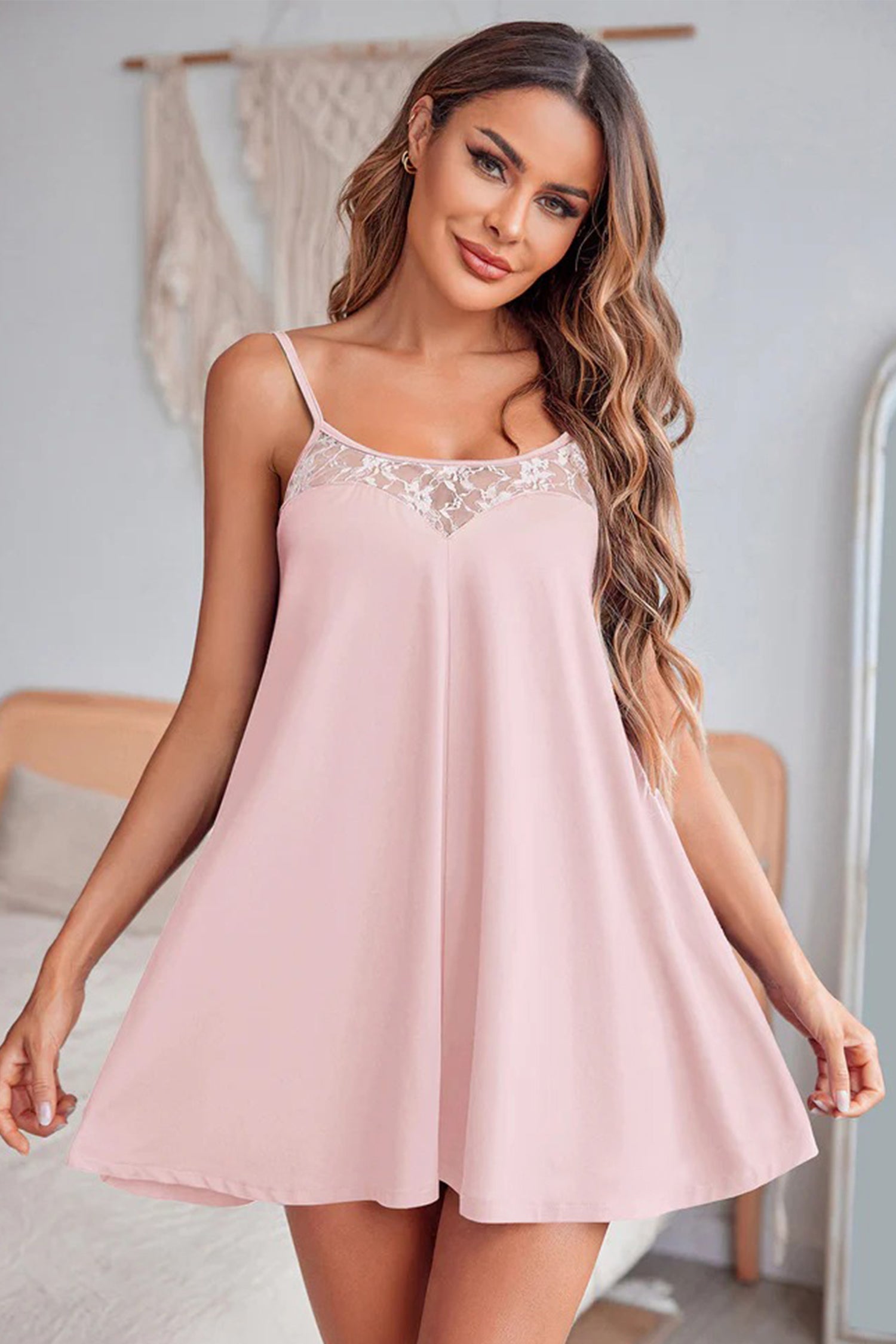 Light pink sheer lace camisole nightgown with spaghetti straps and loose flared silhouette