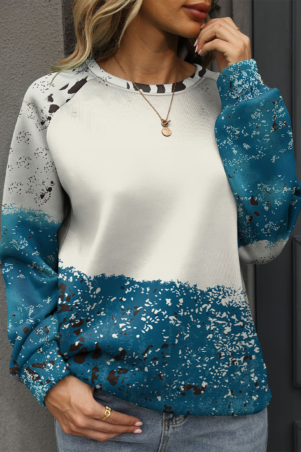 Blue tie dye cow print color block pullover sweatshirt with raglan sleeves