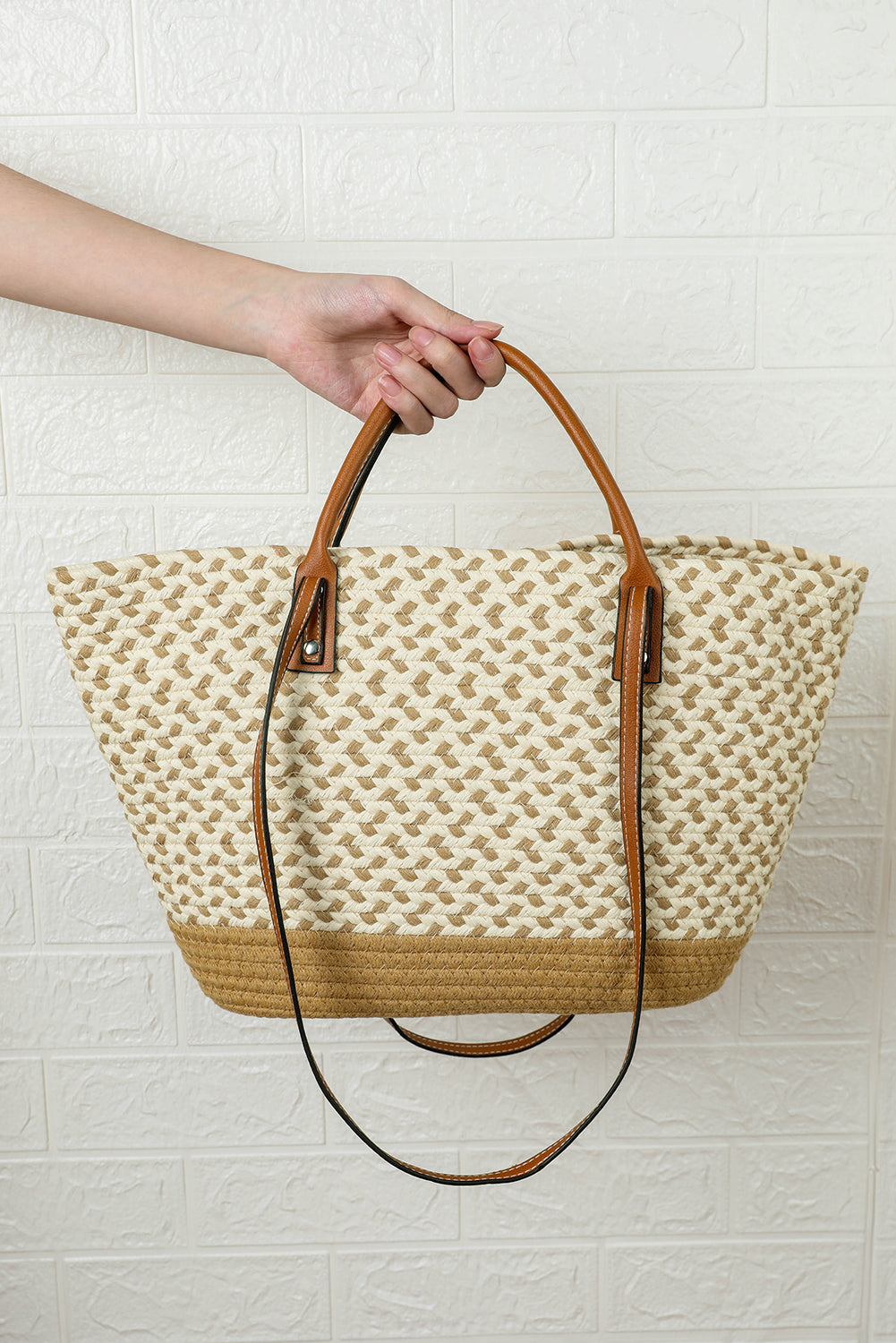 Beige shoulder bag with contrast woven design and PU leather handles, compact size and spacious interior