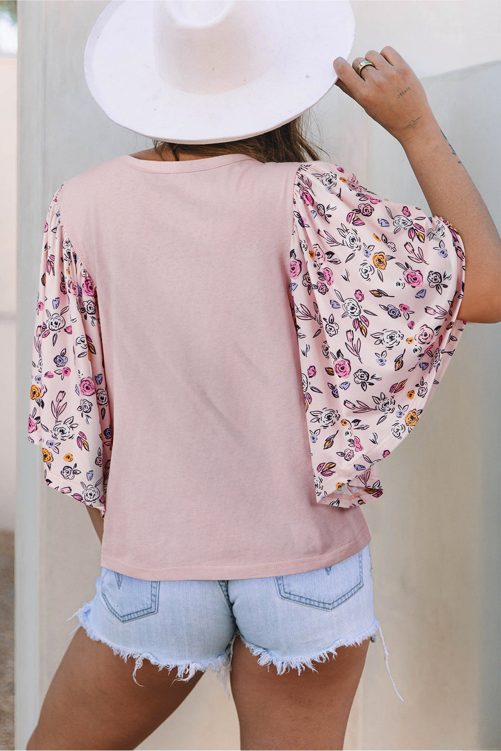 Pink blouse with floral patchwork and flowy half sleeves for summer comfort