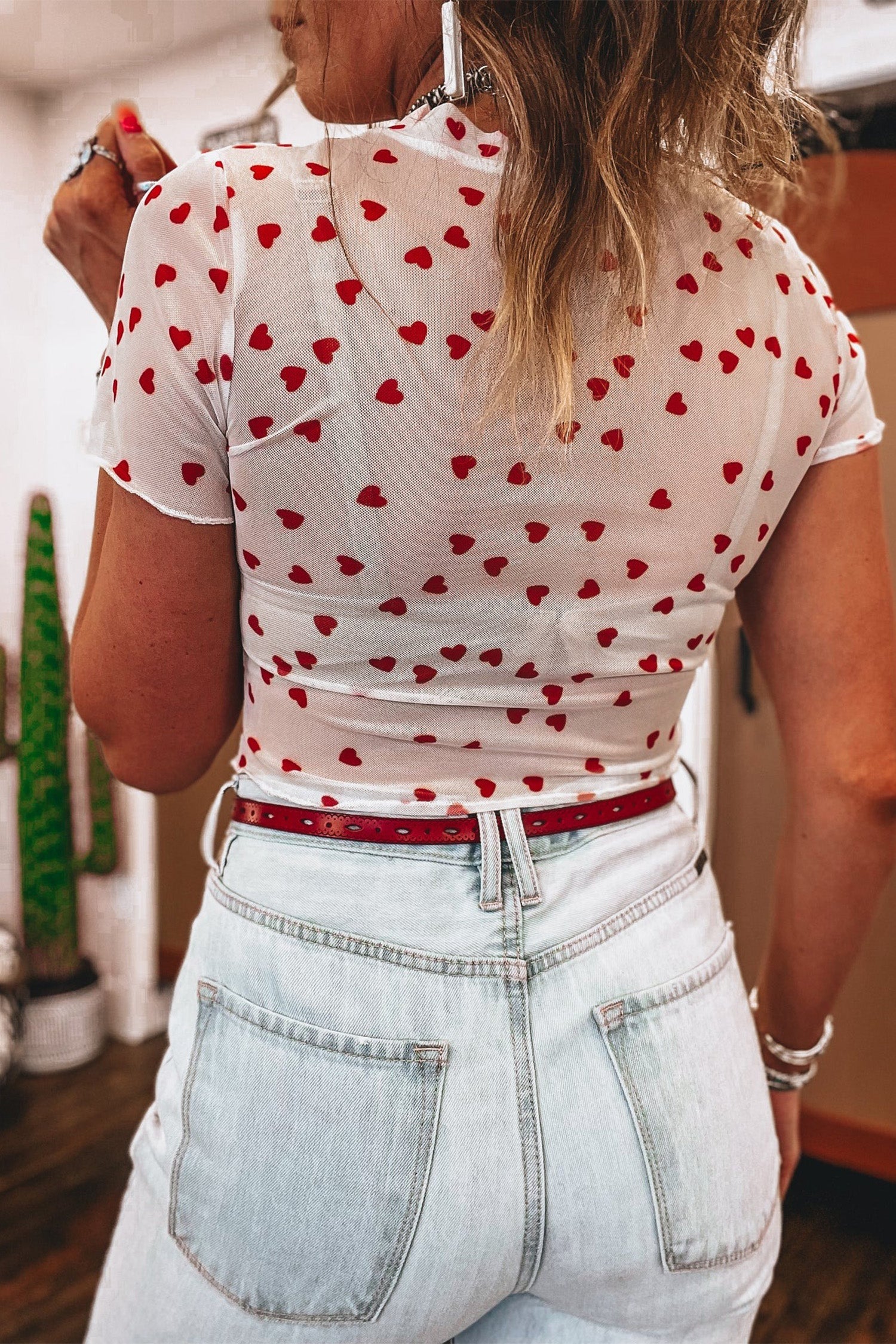 Pink mesh crop top with allover heart print and lettuce trim