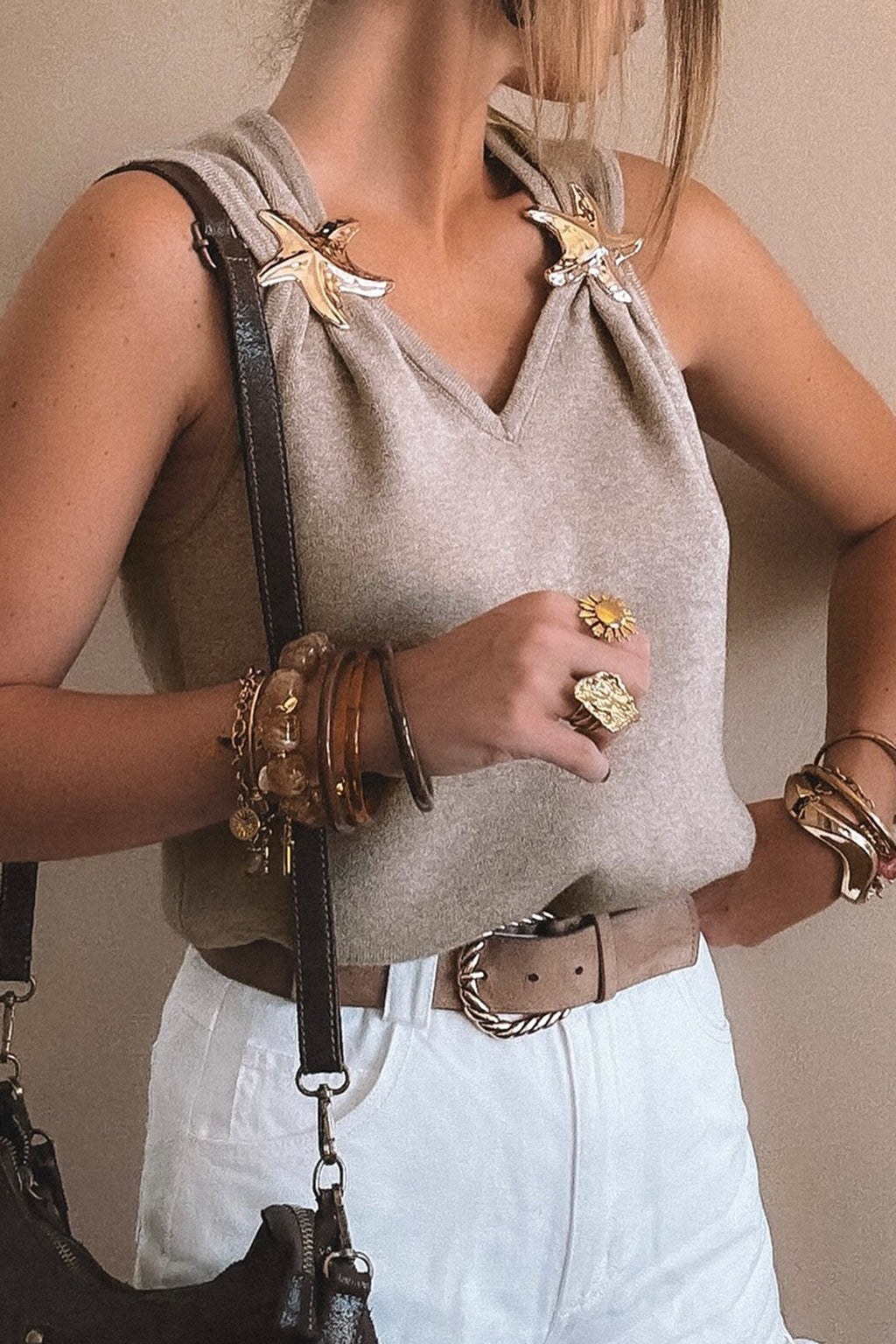 Gray sleeveless V-neck knit tank top with metallic star detail and relaxed fit