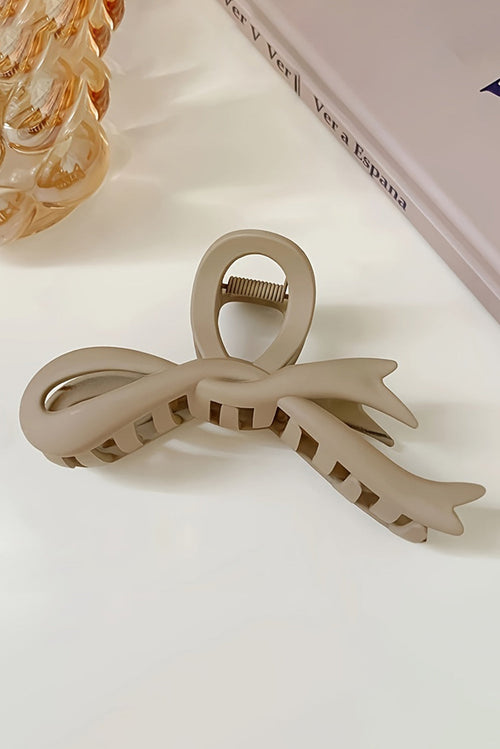 Beige bowknot large hair claw clip on white background