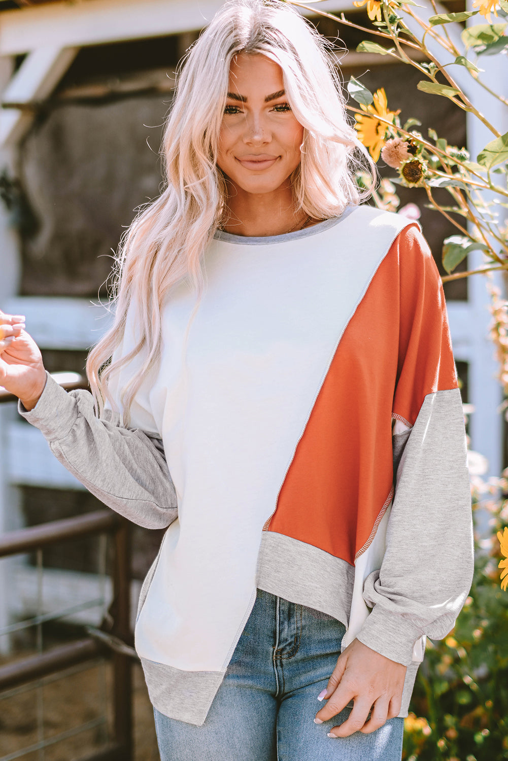 Light French beige colorblock stitching long sleeve top with irregular hem and crew neckline