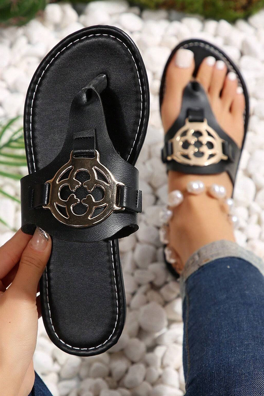 Beige leather thong slippers with stylish metal decor and adjustable strap design