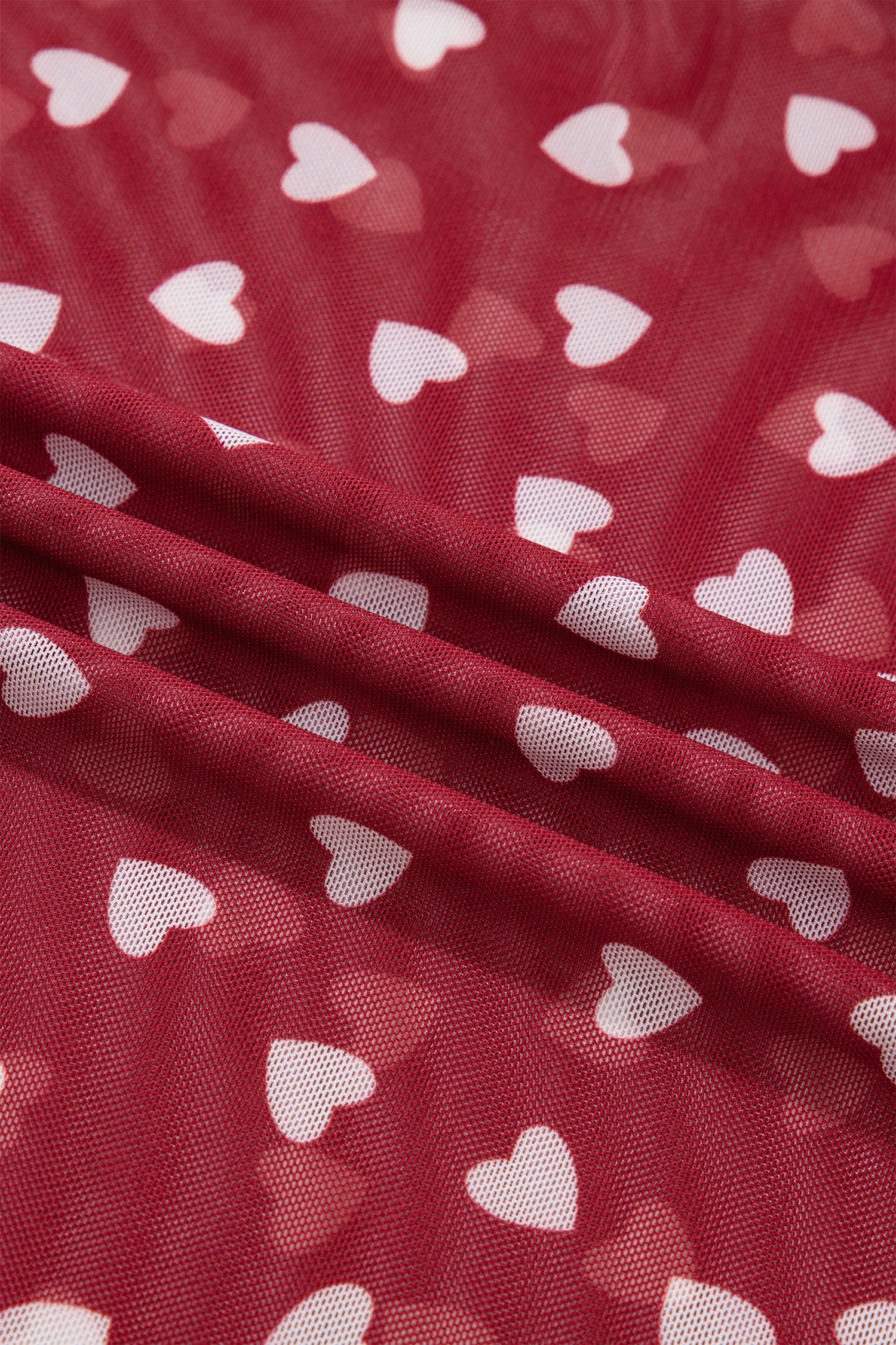 Pink mesh crop top with allover heart print and lettuce trim collar