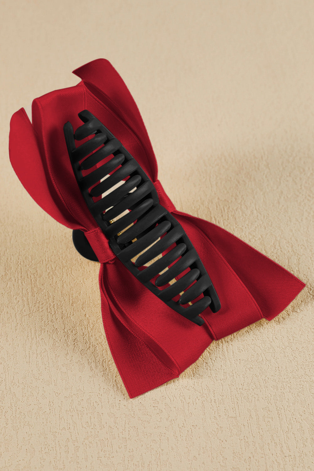 Black bow decor large hair claw clip securing hairstyle elegantly