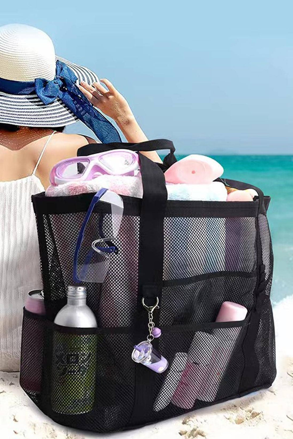 Black multi-pocket large mesh tote bag with sturdy handles, ideal for beach day, showing mesh design and spacious compartments.