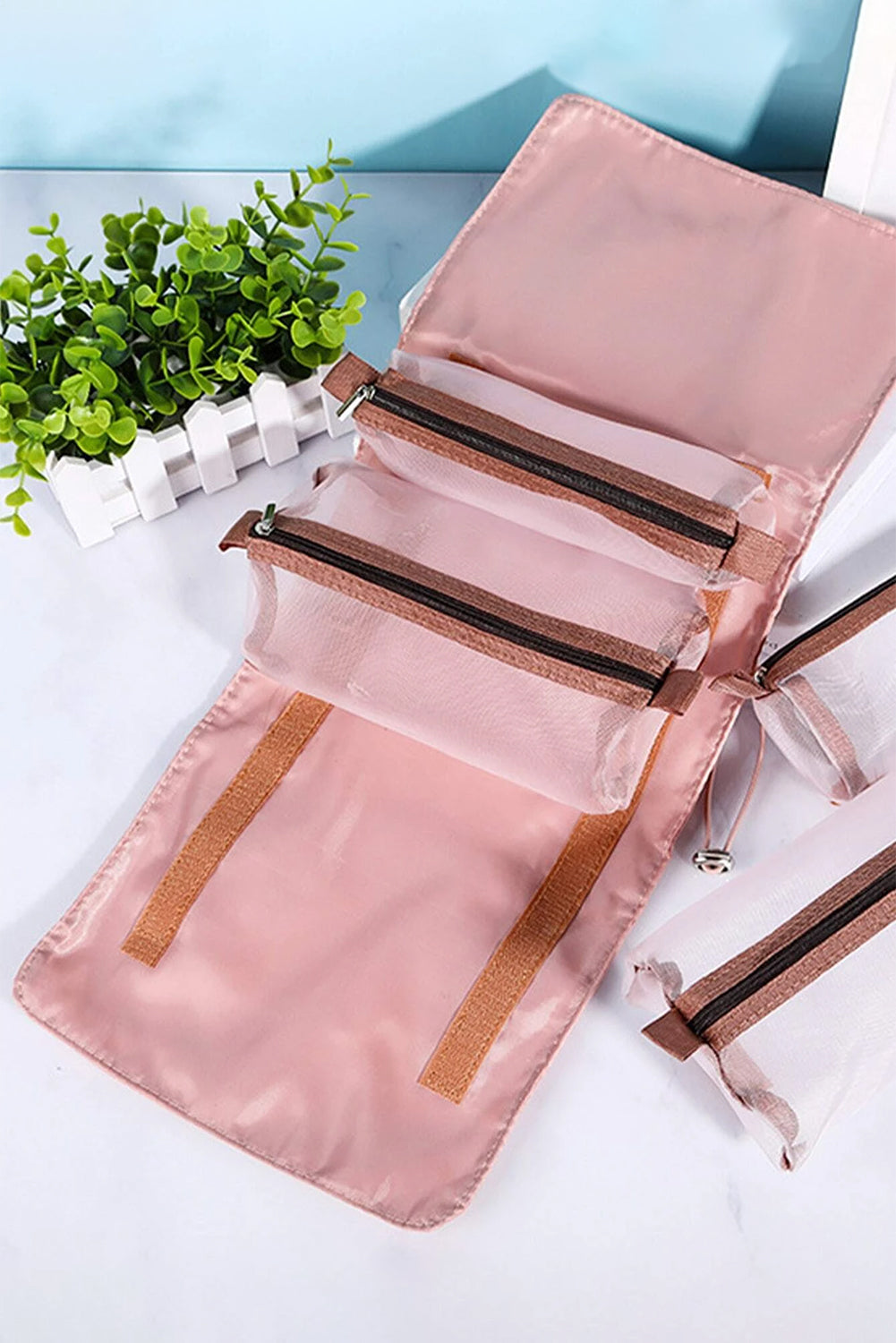 Pink Leegoo detachable 4-in-1 foldable makeup bag with embroidered design and compartments